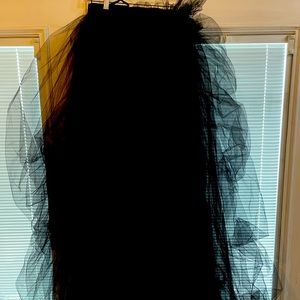 Long, floor length, never been worn black tulle skirt with adjustable waist.